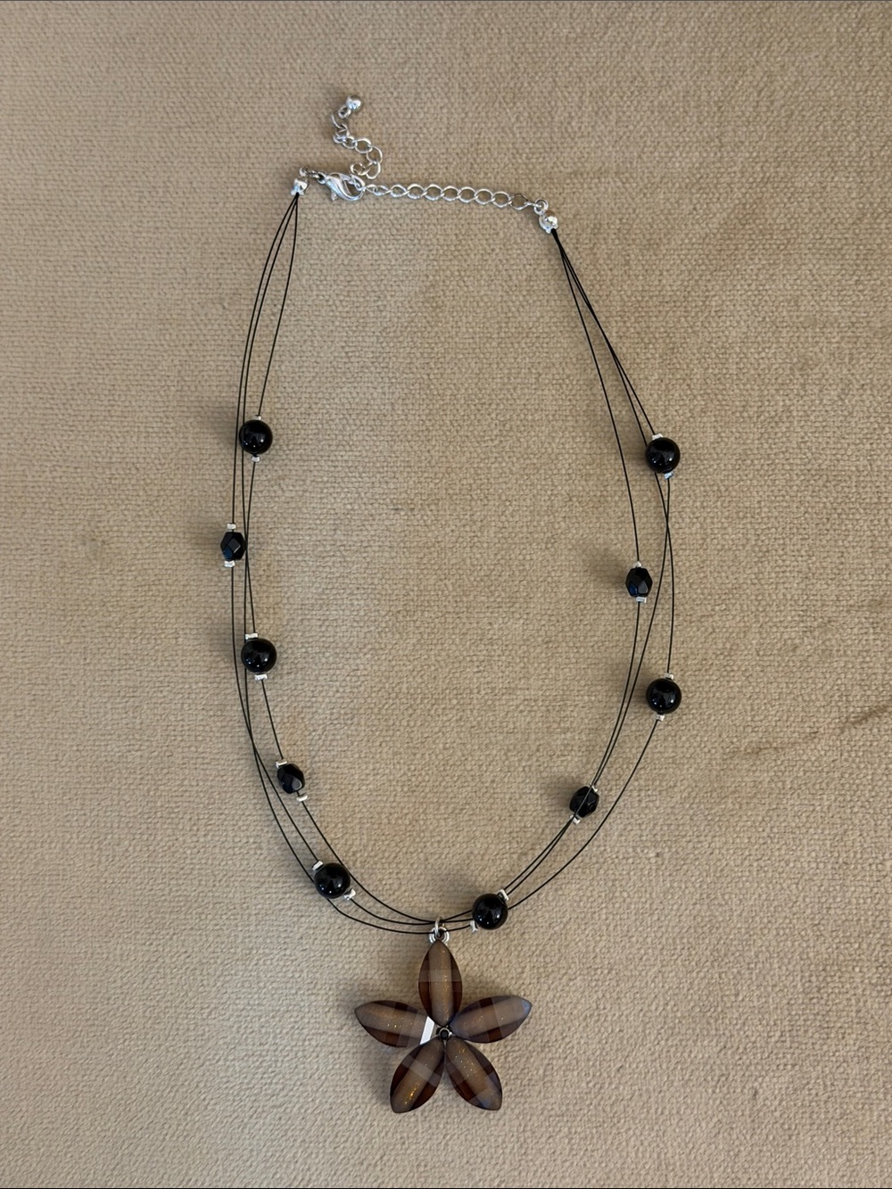 Multi-Strand Black Bead Necklace with Brown Flower Pendant